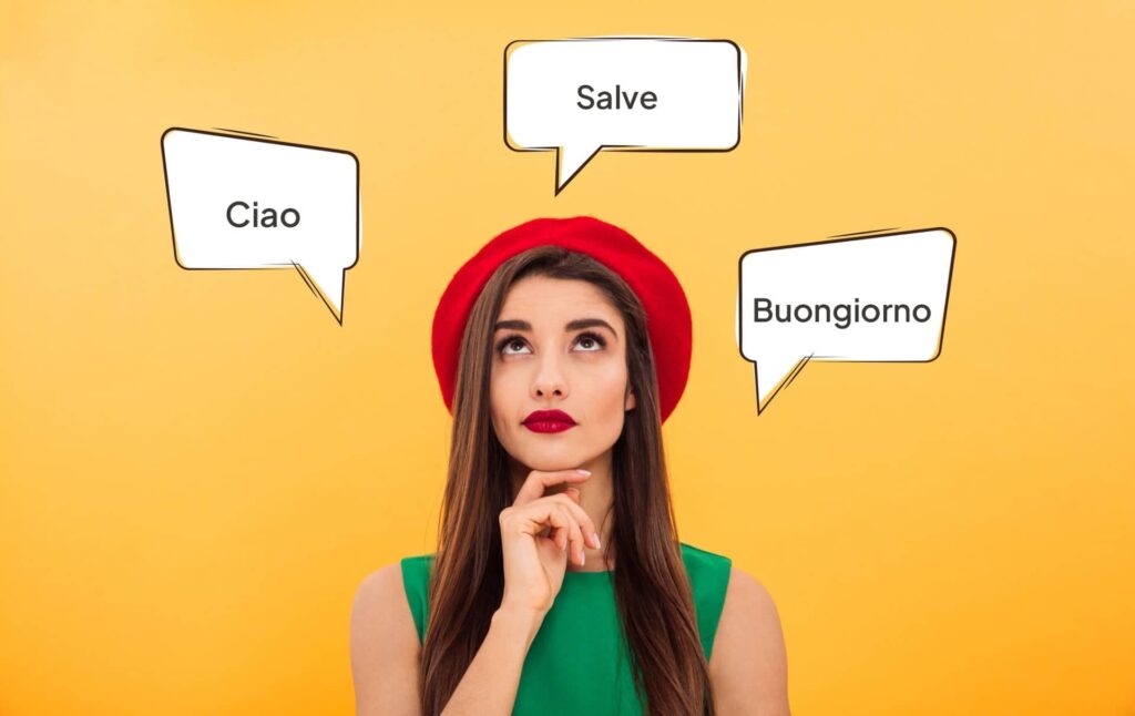 Dame mit einem roten Hut und grünen Oberteil denkt an italienische Begrüßungen