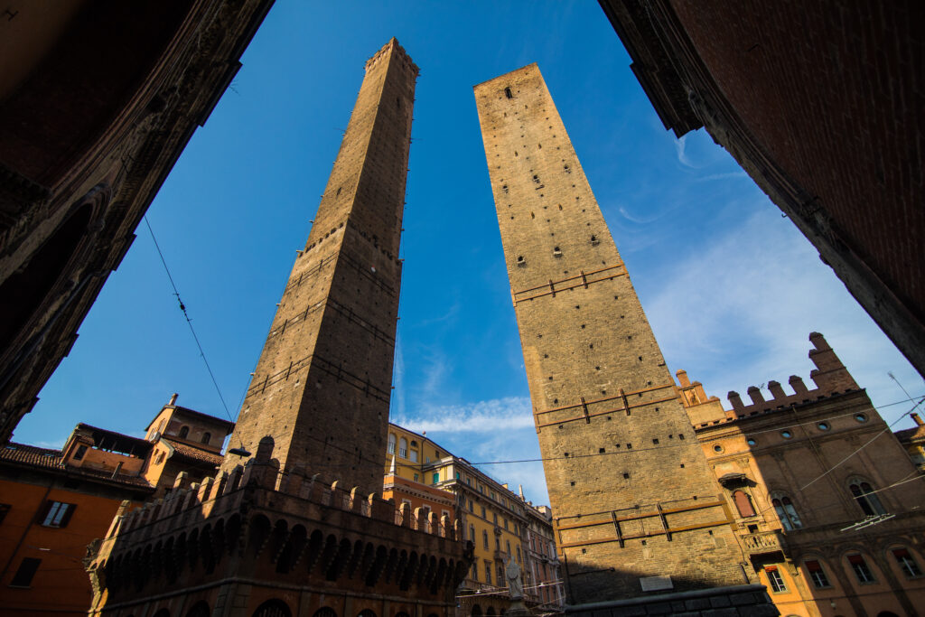 two famous falling towers asinelli and garisenda in the morning, bologna, emilia romagna, italy